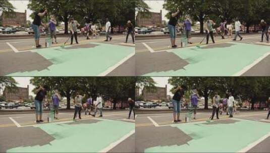 志愿者们在街道上涂颜料高清在线视频素材下载