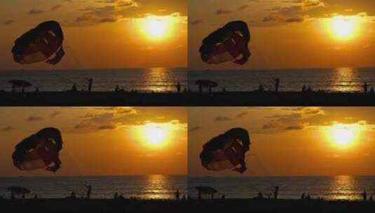 海滩上的降落伞和日落高清在线视频素材下载