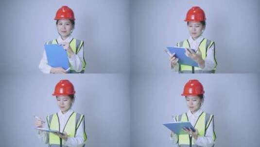 带着安全帽的年轻女性工程师形象高清在线视频素材下载