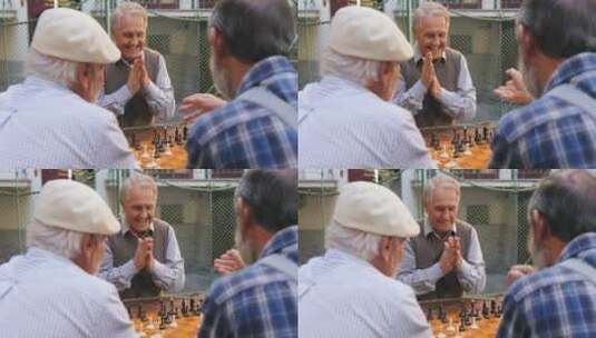 老人朋友在户外下国际象棋高清在线视频素材下载