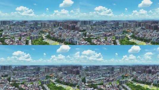 航拍广东惠州蓝天白云城市建筑群街景高清在线视频素材下载