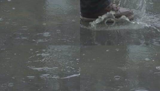 雨滴落在积水上 脚踩水高清在线视频素材下载