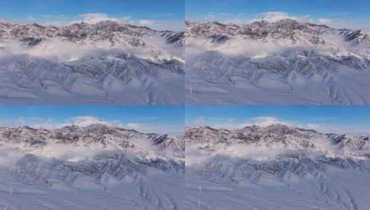 新疆伊犁冬季雪山云雾穿云壮观航拍风景高清在线视频素材下载