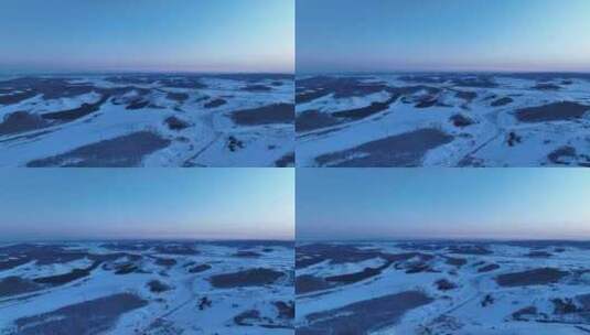 航拍夕阳照耀下的内蒙古雪原风光高清在线视频素材下载