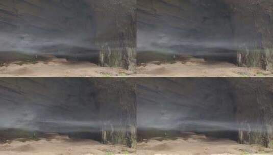 一名摄影师在神秘的山洞里寻找拍摄素材高清在线视频素材下载