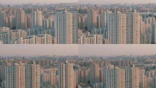 无人机长焦航拍夕阳城市高楼建筑高清在线视频素材下载