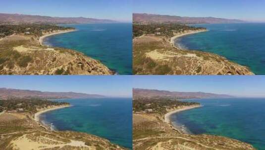 一个阳光明媚的夏日，无人机拍摄了加利福尼亚州马里布著名的杜梅州海滩。高清在线视频素材下载