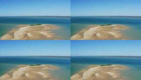 空中4K无人机天桥赫维湾与世隔绝的沙岛被蓝色绿松石海洋包围，澳大利亚高清在线视频素材下载