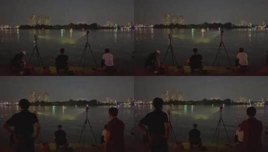夜晚河边野钓的人群河流游船高清在线视频素材下载