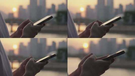 日落时使用手机的年轻人高清在线视频素材下载