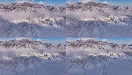 新疆伊犁冬季雪山云雾穿云壮观航拍风景高清在线视频素材下载