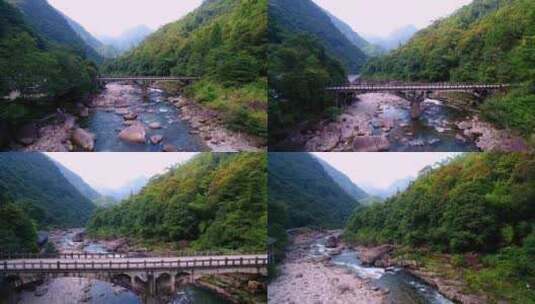 航拍武夷山桐木溪峡谷森林中的清澈溪流岩石高清在线视频素材下载