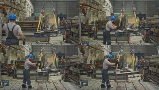 工厂工人从起重机上的起重皮带上取下沉重的高清在线视频素材下载