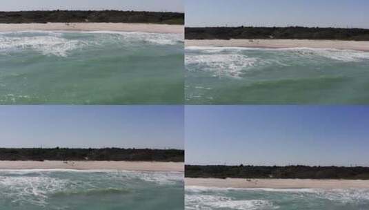 航拍海浪冲击海滩高清在线视频素材下载