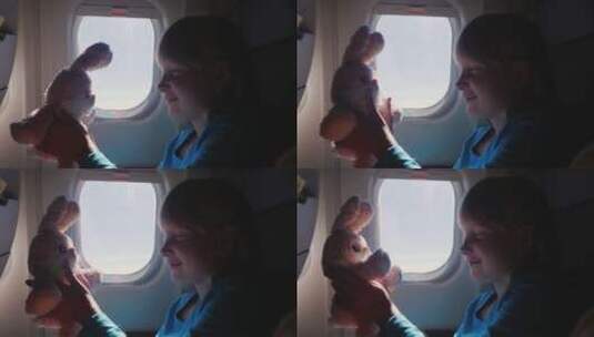 这个女孩带着她最喜欢的玩具在飞机上旅行高清在线视频素材下载