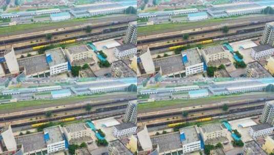 中国辽宁沈阳苏家屯火车站中的黄色火车航拍高清在线视频素材下载