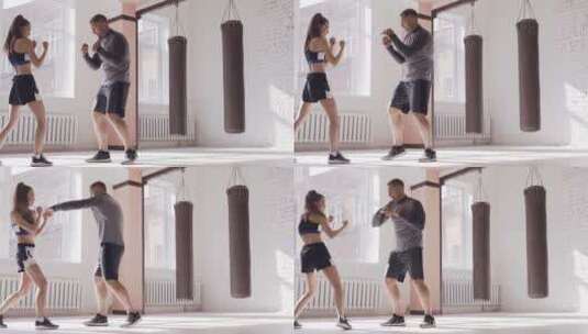 教练在拳击馆教女生拳击高清在线视频素材下载