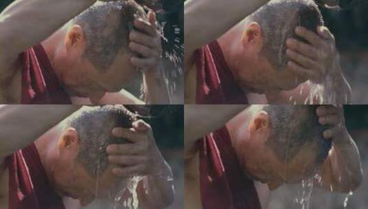 僧人在用水洗头高清在线视频素材下载