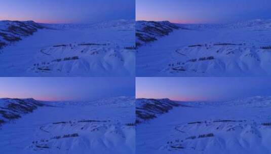 新疆阿勒泰雪山红色夕阳下的村落高清在线视频素材下载