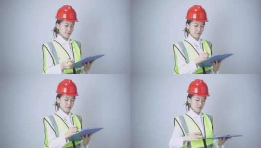 带着安全帽的年轻女性工程师形象高清在线视频素材下载