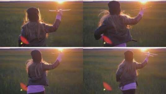 小女孩拿着纸飞机向着夕阳奔跑高清在线视频素材下载