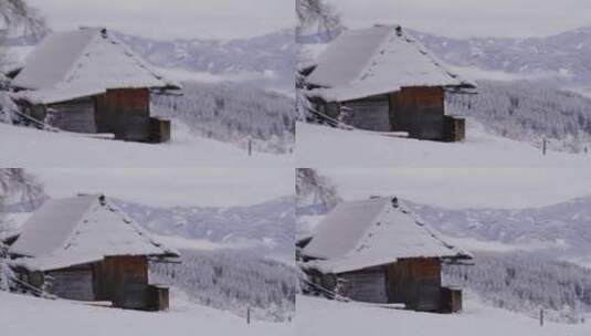 雪山森林山脚下的房屋高清在线视频素材下载