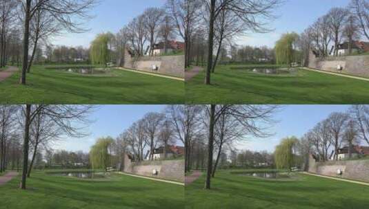 城市小区里的池塘和树木高清在线视频素材下载