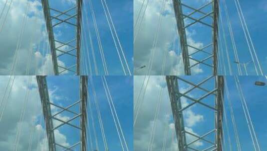 桥梁结构行驶仰拍仰望钢架大桥蓝天白云高清在线视频素材下载