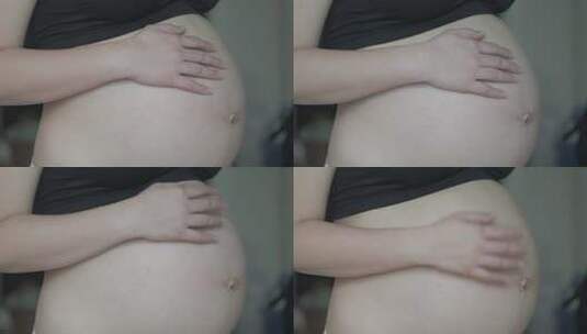 孕妇温柔的抚摸肚子高清在线视频素材下载