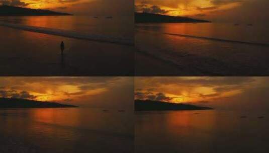 航拍夕阳下美女在海边沙滩散步日落黄金海岸高清在线视频素材下载