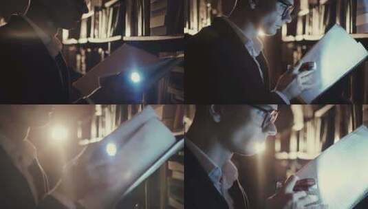 男人夜间拿着手电筒在图书馆看书高清在线视频素材下载
