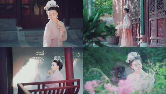 古装女子持扇立于古门前高清在线视频素材下载