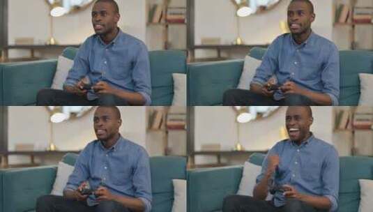非洲人在沙发上玩游戏高清在线视频素材下载