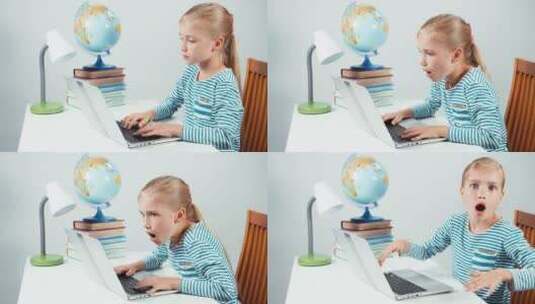 小女孩坐在桌前用电高清在线视频素材下载