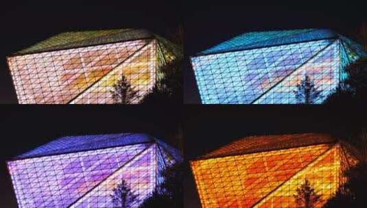 抽象科幻的大剧院玻璃幕墙多彩夜景灯光高清在线视频素材下载