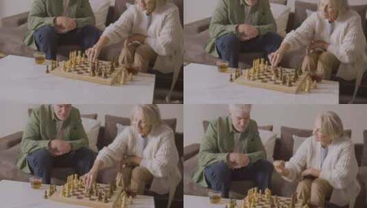 坐在沙发上下棋的老年人高清在线视频素材下载