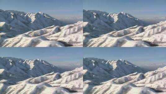 空中拍摄雪山和远处的盐湖谷高清在线视频素材下载