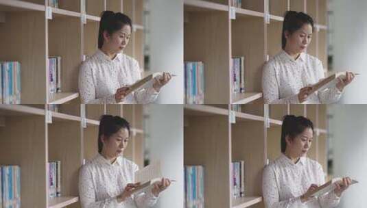 中年女性在图书馆内阅读看书高清在线视频素材下载