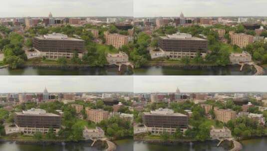 4k航拍镜头从左到右平移威斯康星州的首都大楼和周围的建筑高清在线视频素材下载