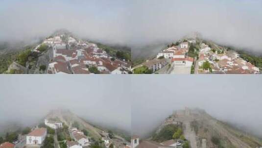 一架无人机飞过葡萄牙村庄的橙色瓦顶，进入马里奥城堡的遗迹高清在线视频素材下载