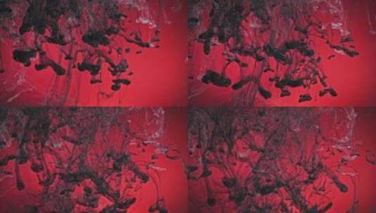黑色油漆在红色背景下掉入水中高清在线视频素材下载
