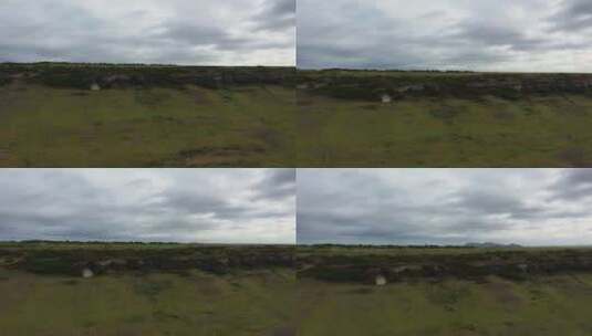 一架无人驾驶飞机在一座平坦的山上飞行，结高清在线视频素材下载