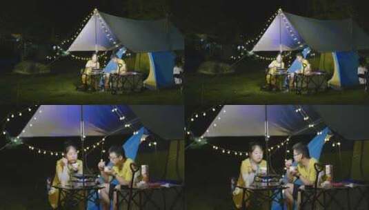 夜晚郊外露营-情侣在帐篷边野炊高清在线视频素材下载
