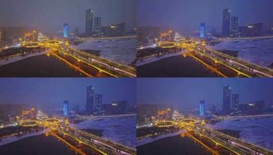 中国黑龙江哈尔滨公路大桥夜晚雪景航拍高清在线视频素材下载