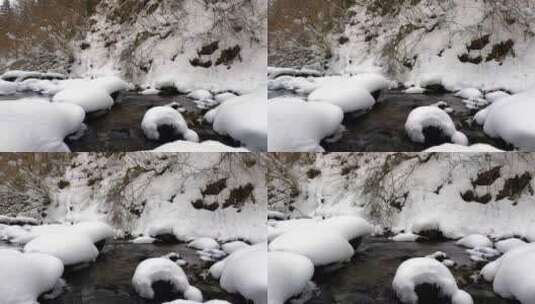 大雪过后的森林积雪和溪流高清在线视频素材下载