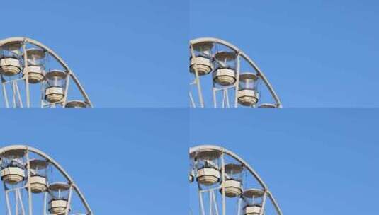 晴朗夏季摩天轮的镜头，背景是在城市拍摄的高清在线视频素材下载