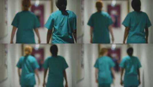 两名医护人员走在走廊里高清在线视频素材下载
