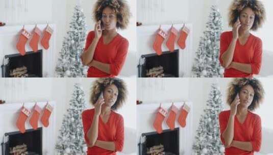 年轻女子在圣诞节用手机聊天高清在线视频素材下载