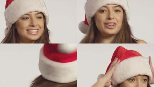 戴着圣诞帽的女人对镜头唱歌跳舞高清在线视频素材下载
