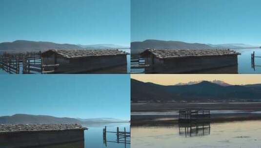 湖泊慢镜头视频云南香格里拉纳帕海水养殖房高清在线视频素材下载